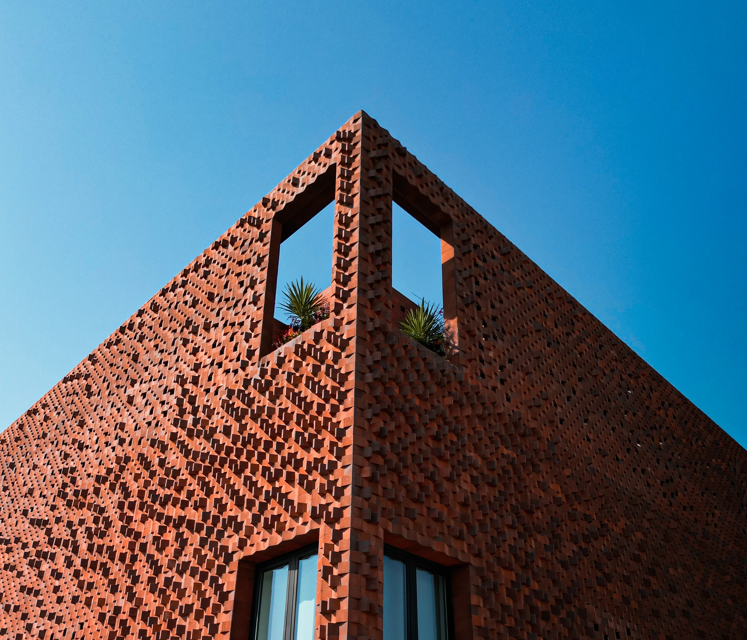 The patterned brick facade of Al-Yamama Eye Center in Baghdad